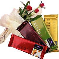 Durga Puja Flowers Delivery in India. 4 Cadbury Temptation Chocolates With 3 Red Roses. Durga Puja Gifts to India