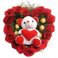 Send Online Gifts to India. Order for 18 Red Roses with 5 Ferrero Rocher Chocolates and Teddy Gifts to India