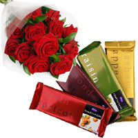 Online Gift of 4 Cadbury Temptation Bars with 12 Red Roses Bunch and Rakhi Flowers to India