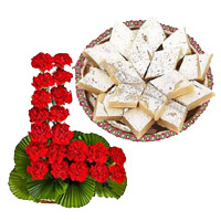 Send 24 Red Carnation Basket, 1/2 Kg Kaju Burfi Sweet and Rakhi to India