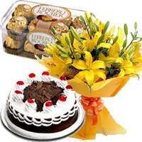 Send Diwali Chocolates to India. 12 Yellow Lily with 1/2 Kg Black Forest Cake and 16 Pcs Ferrero Rocher Chocolates in Ernakulam