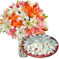 Order 18 Pink White Lily Vase and 1/2 Kg Kaju Katli Sweet to India. Online Rakhi Gifts and Flowers to India