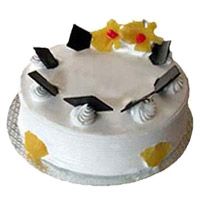 Cake Delivery in India to send 1 Kg Eggless Pineapple Cake From 5 Star Bakery