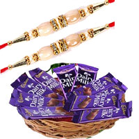 Send Gifts to India Online that includes Dairy Milk Basket 12 Chocolates With 12 Pink Roses on Rakhi