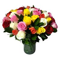 Order New Born Flowers in Baroda. Mixed Roses Vase 30 Flowers Delivery to India